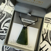 Greenstone pendant in a branded box with 'Pounamu' label